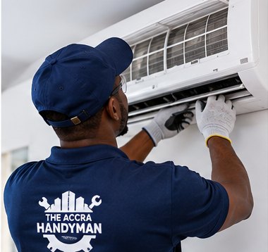 A technician servicing an A/C unit